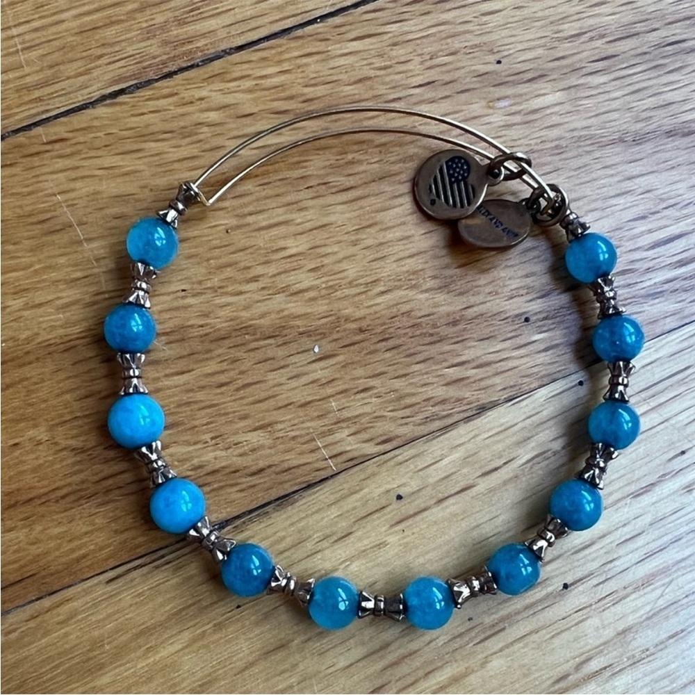 Gold Alex and Ani Bangle with Blue Beads